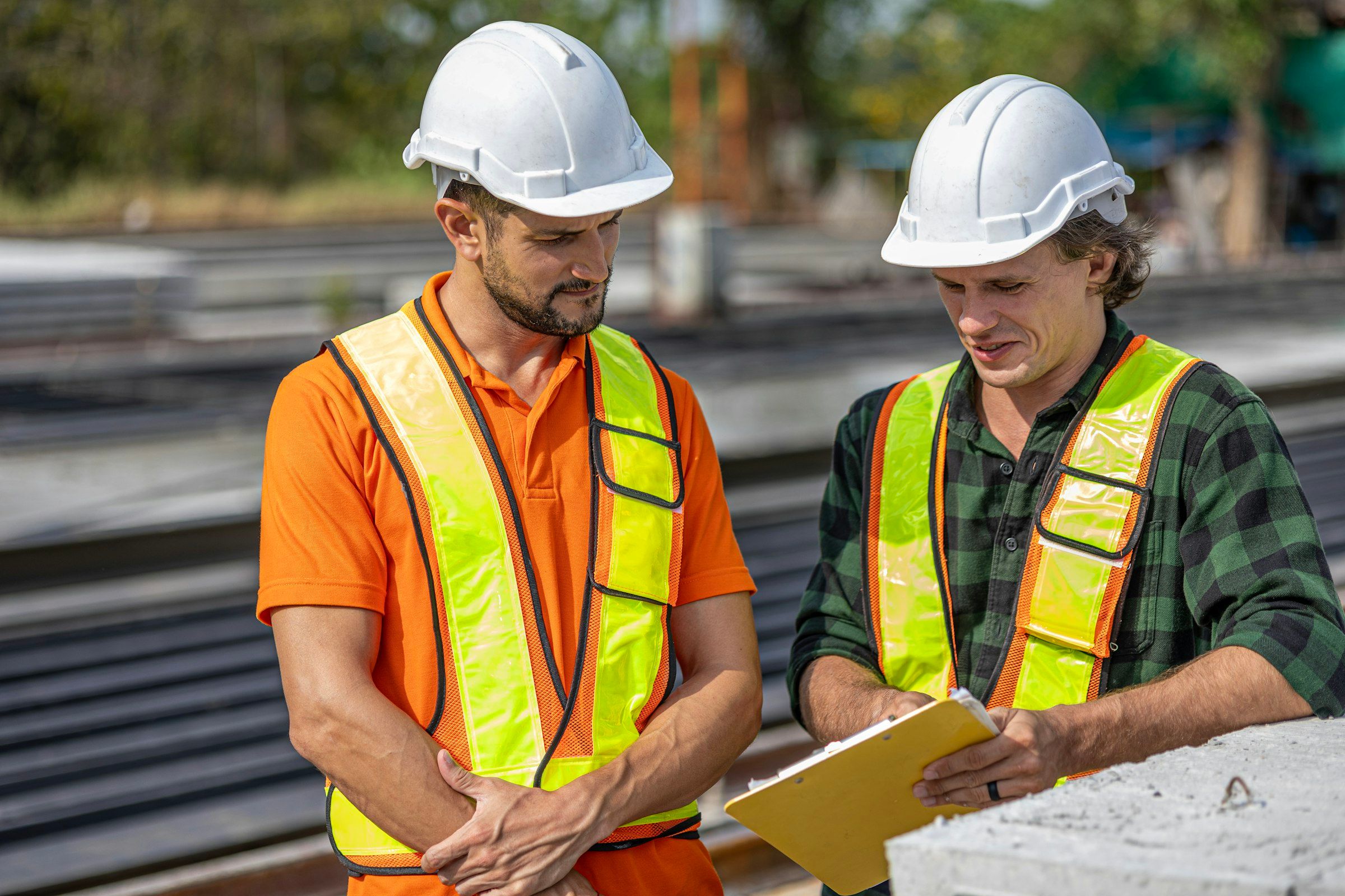 Two site engineers reviewing plans